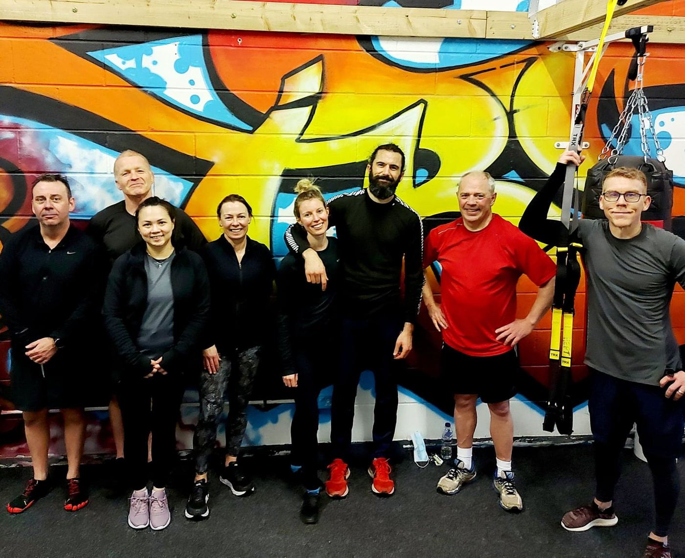 Members by the mural