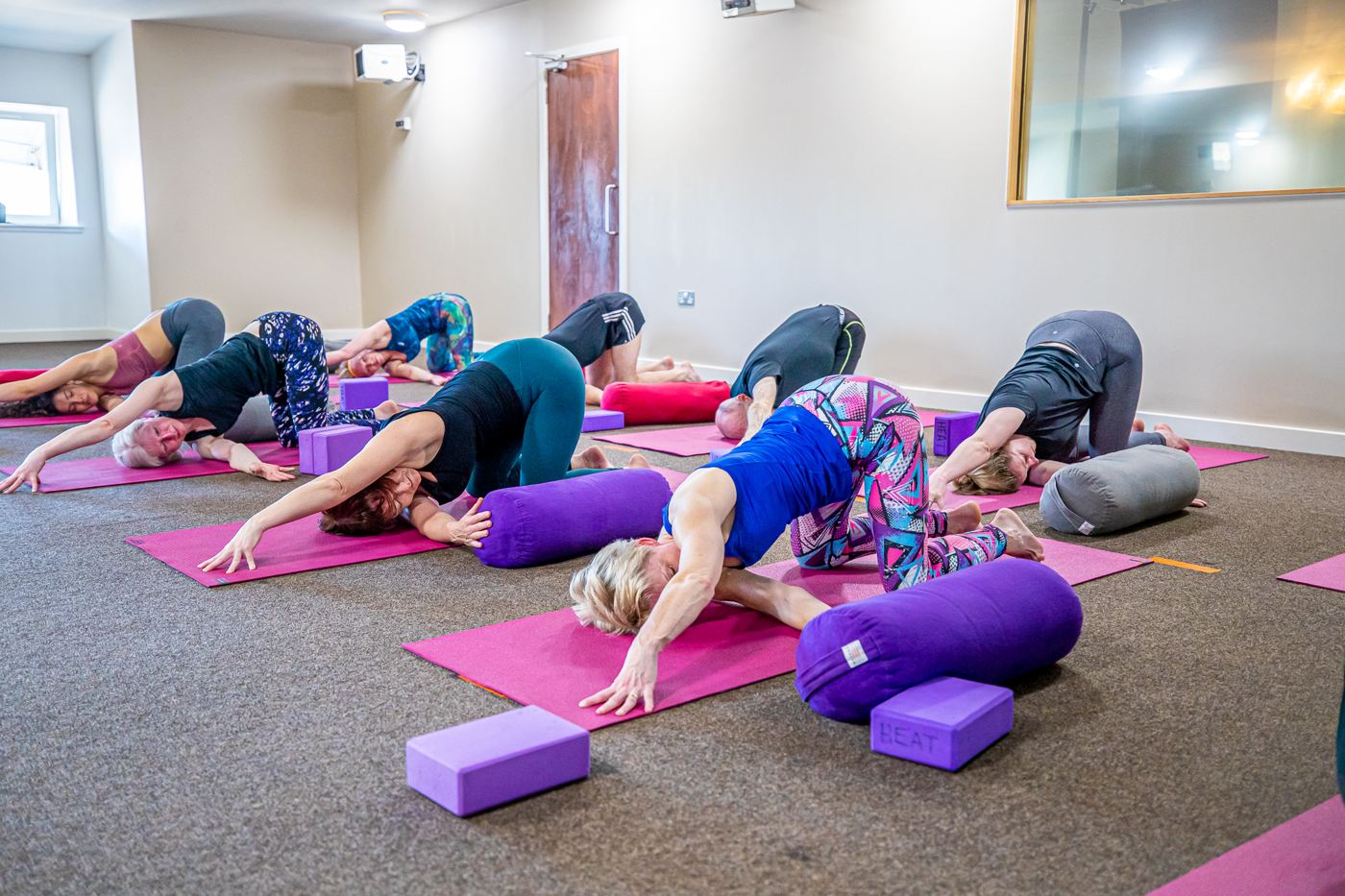 Yoga with bolsters and blocks